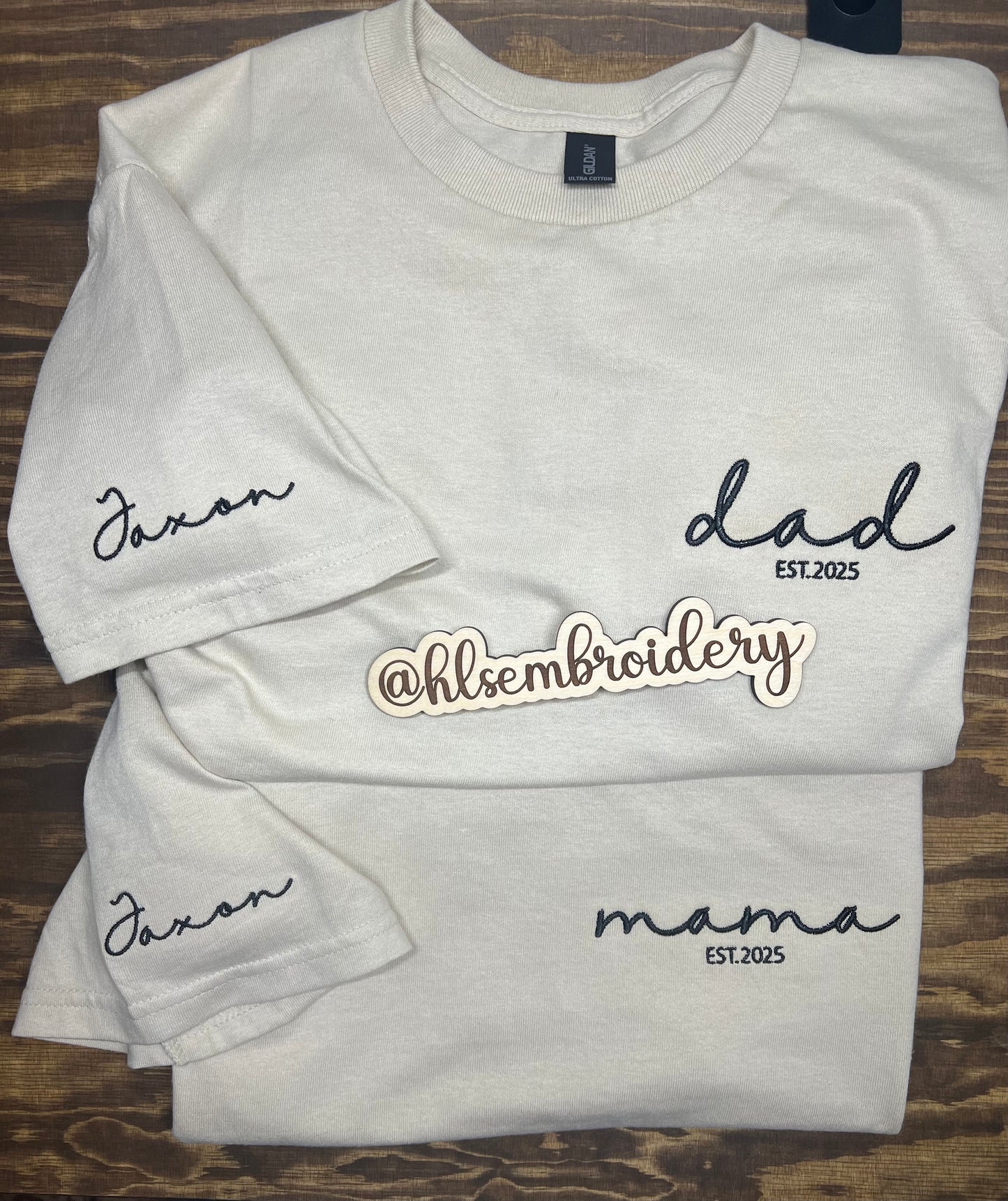 Two Sand color shirts with embroidery on the front