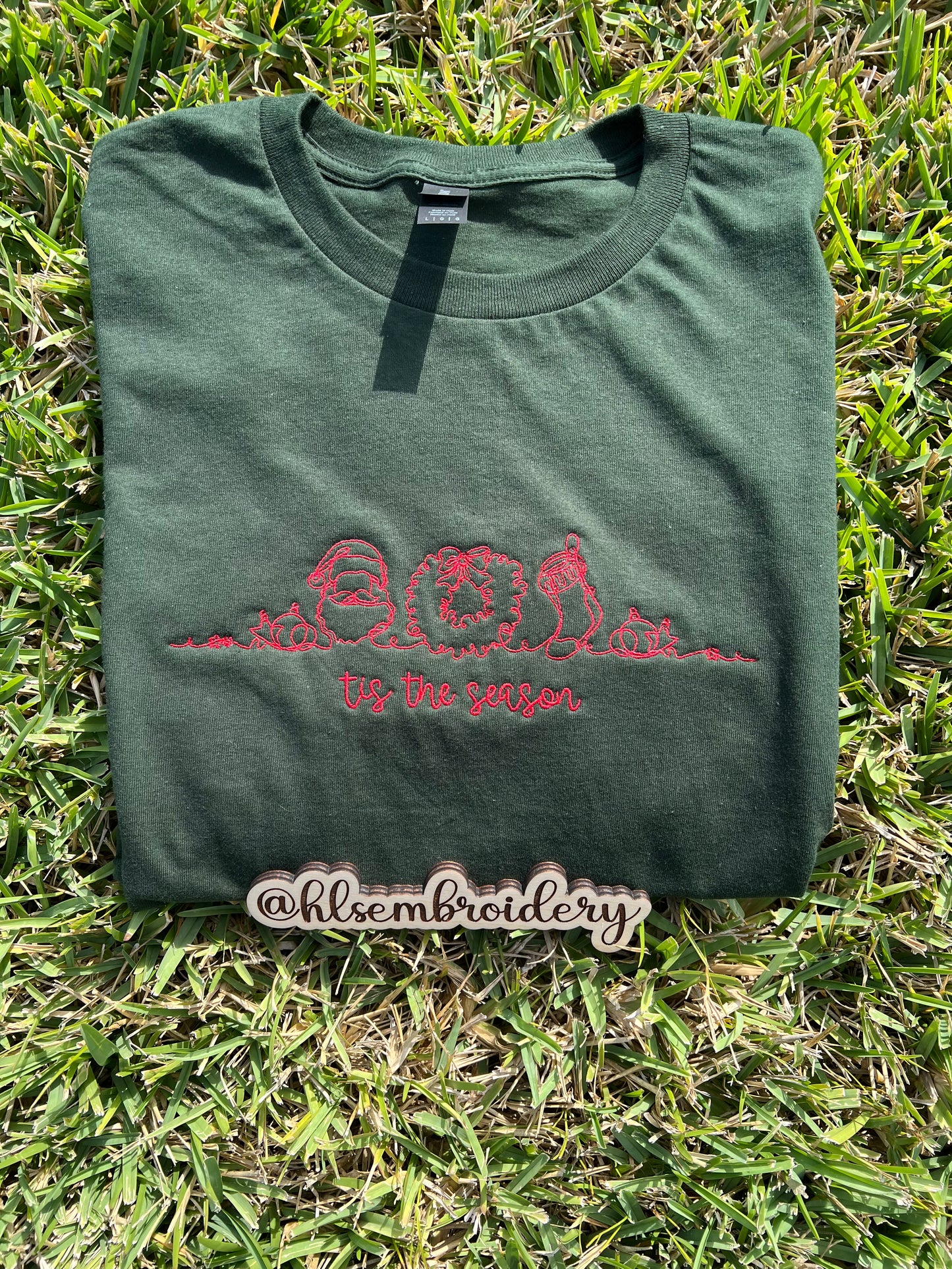 Green t-shirt with red embroidery design