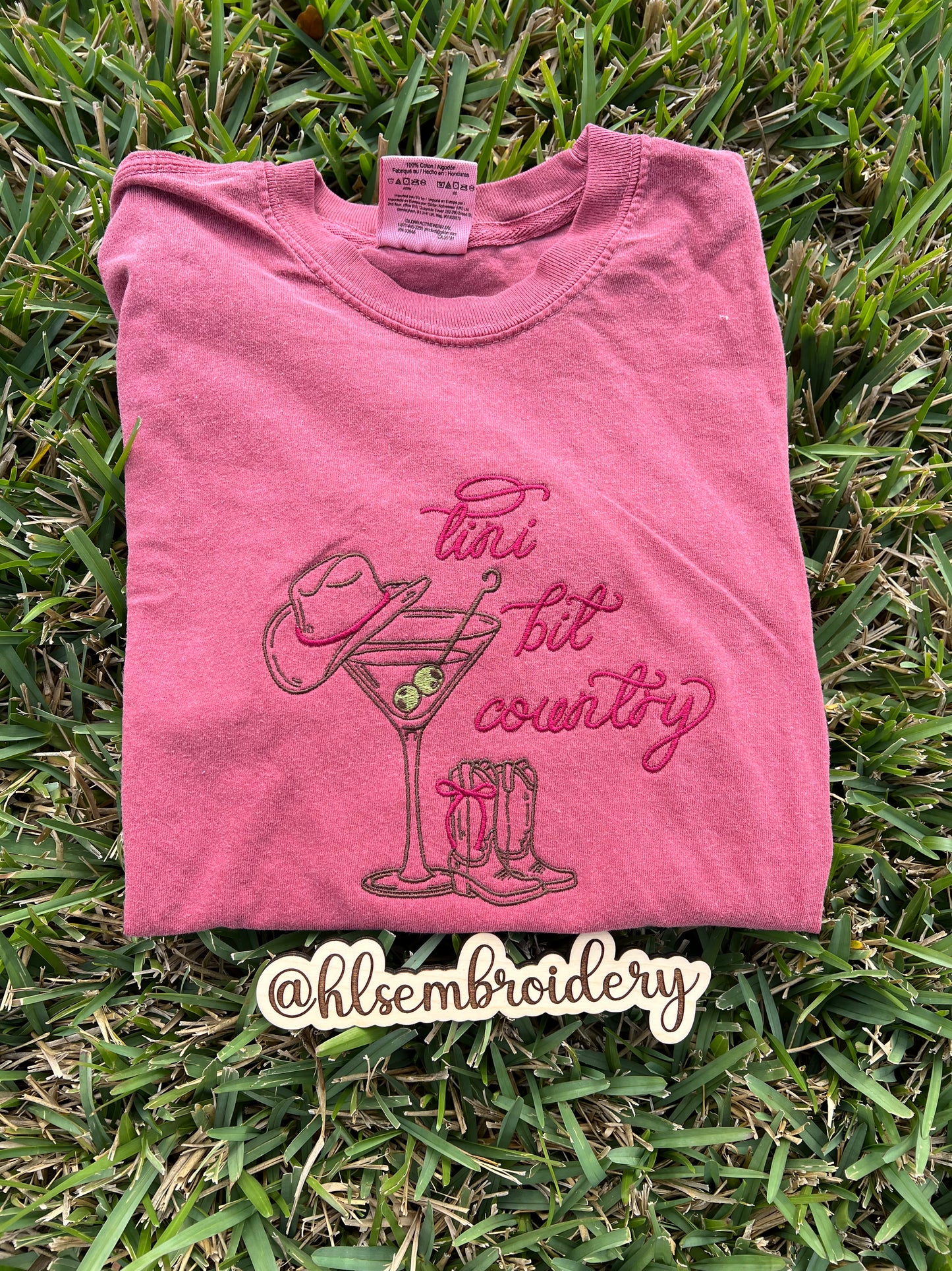 Comfort colors crimson t-shirt with 'tini bit country' design embroidered on it