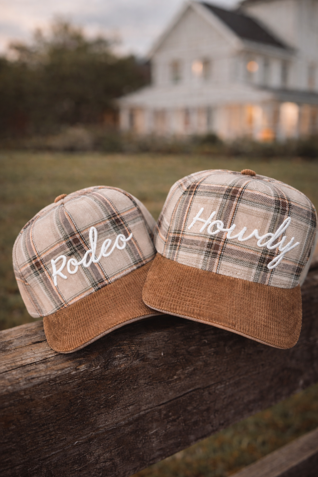 Plaid hats with embroidered words Rodeo and one with Howdy