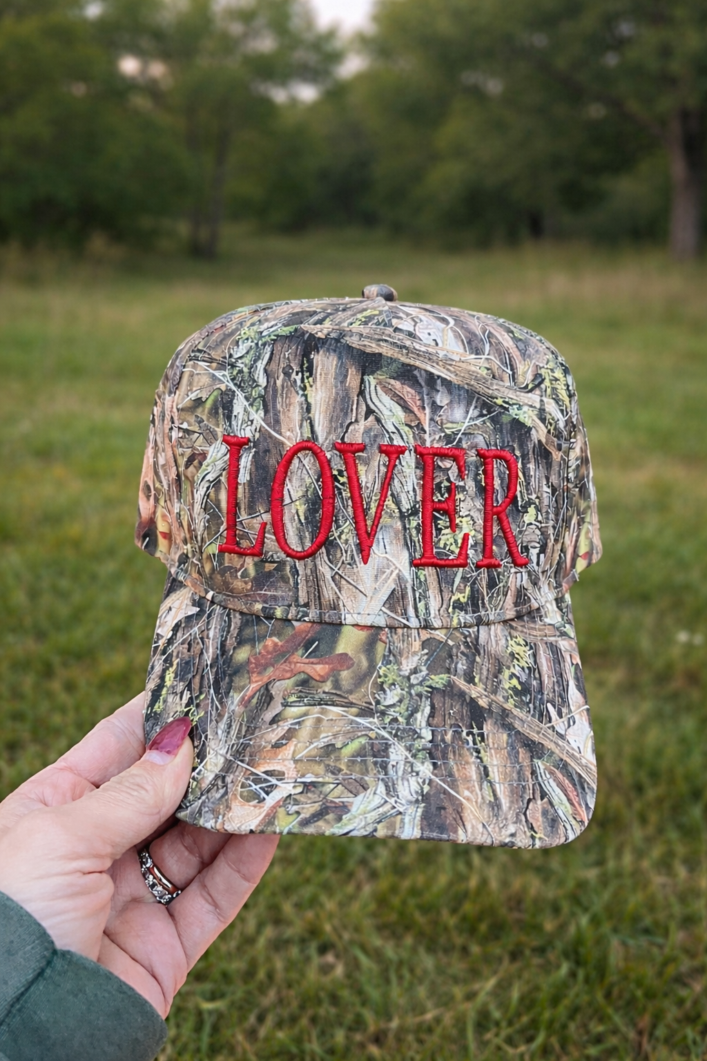 Camo hat with Lover embroidered in puff font