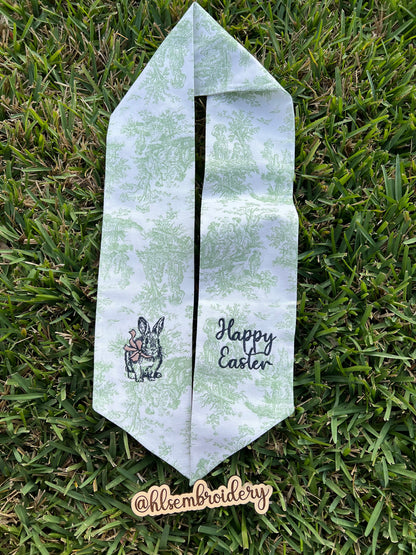 Green Toile Wreath sash with bunny and bow and happy Easter embroidered on it. 