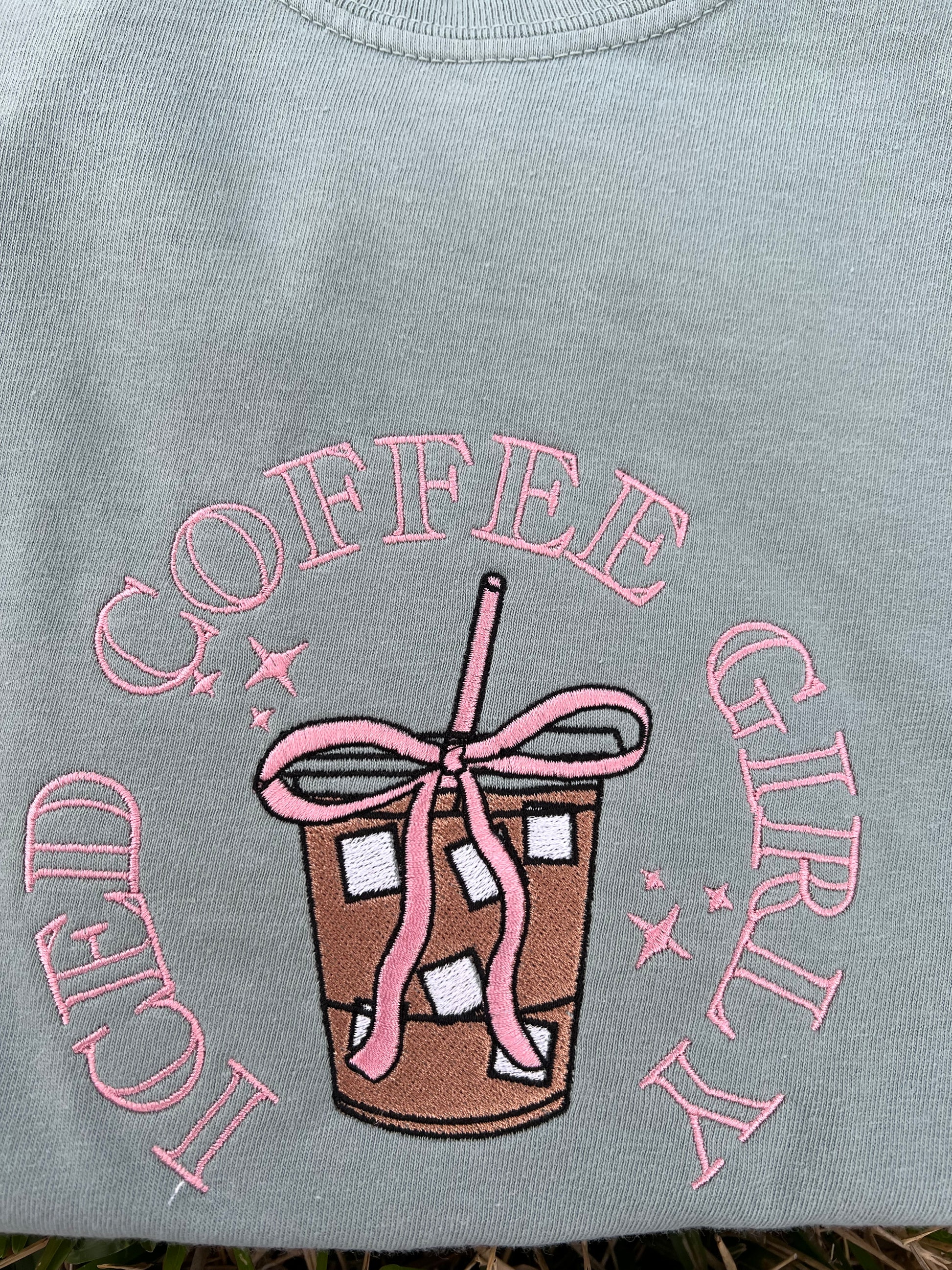 Light green shirt with pink 'Coffee Girlie' embroidery and coffee cup design.