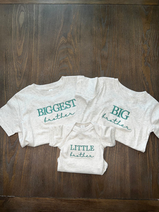 Three shirts with embroidery on the front