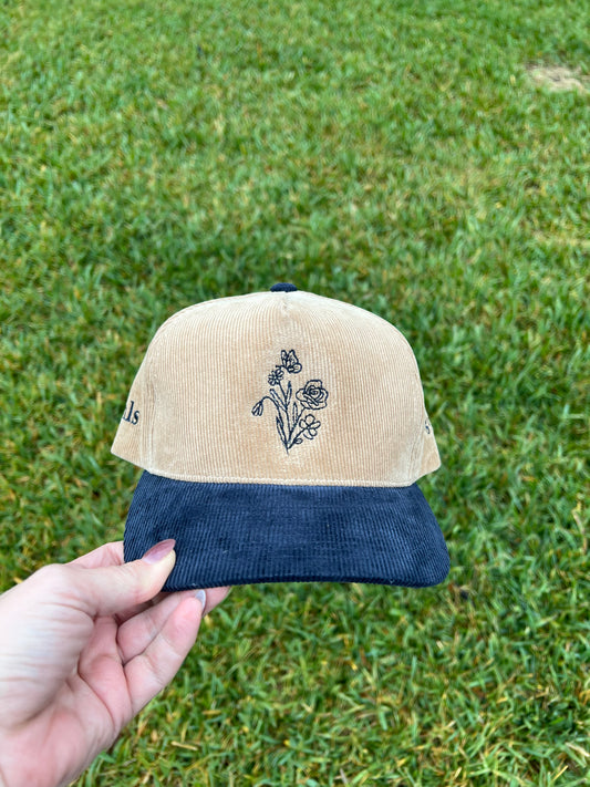 hlsembroidery signature floral detail embroidered on front of beige and navy corduroy hat 