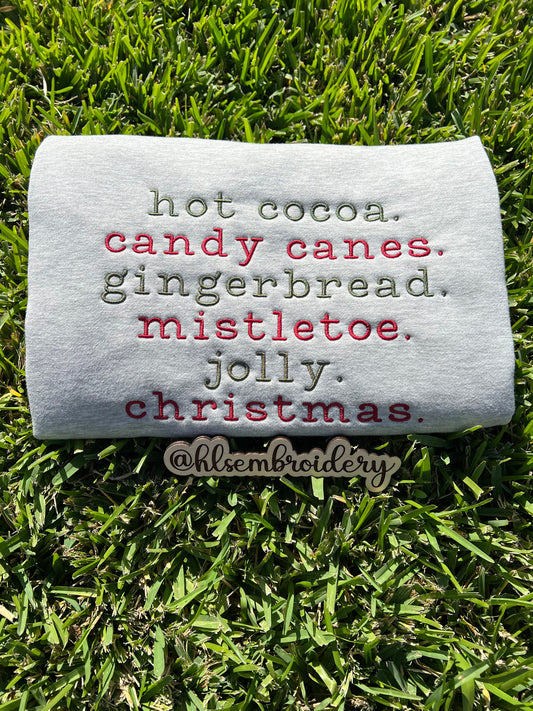 Christmas wording embroidered on gray fabric 