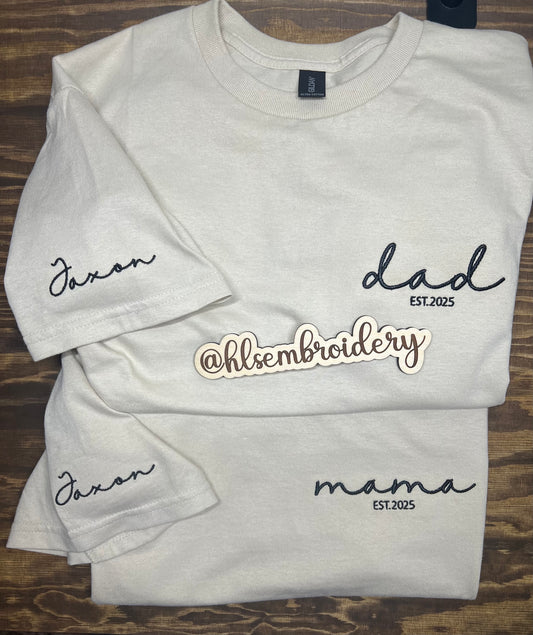 Two Sand color shirts with embroidery on the front 