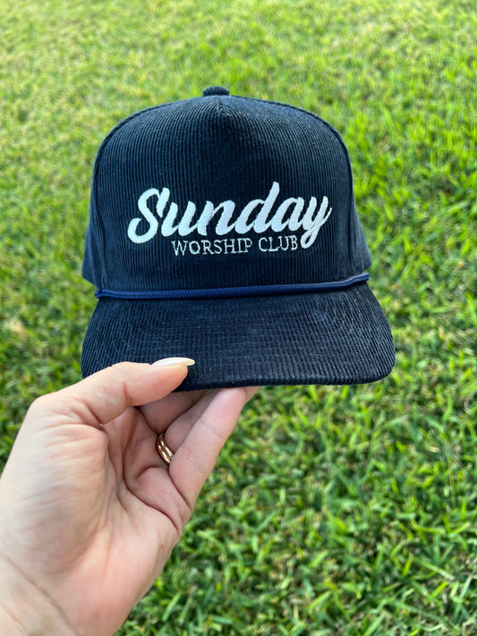 Navy corduroy cap with top, with embroidered text "Sunday worship club"