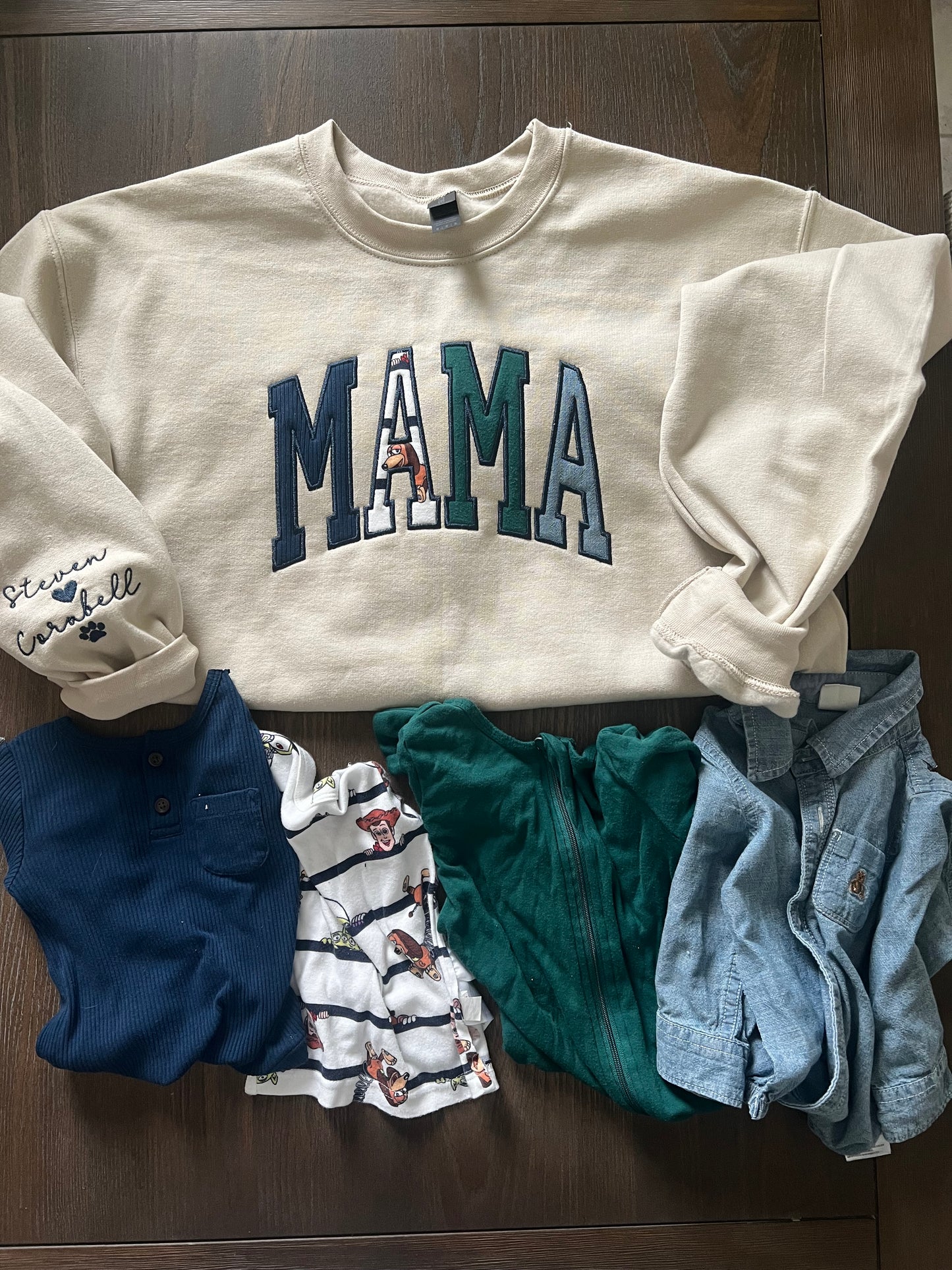 Mama embroidered crewneck using baby clothing and sleeve embroidered detail. 