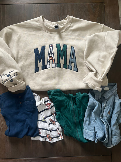 Mama embroidered crewneck using baby clothing and sleeve embroidered detail. 
