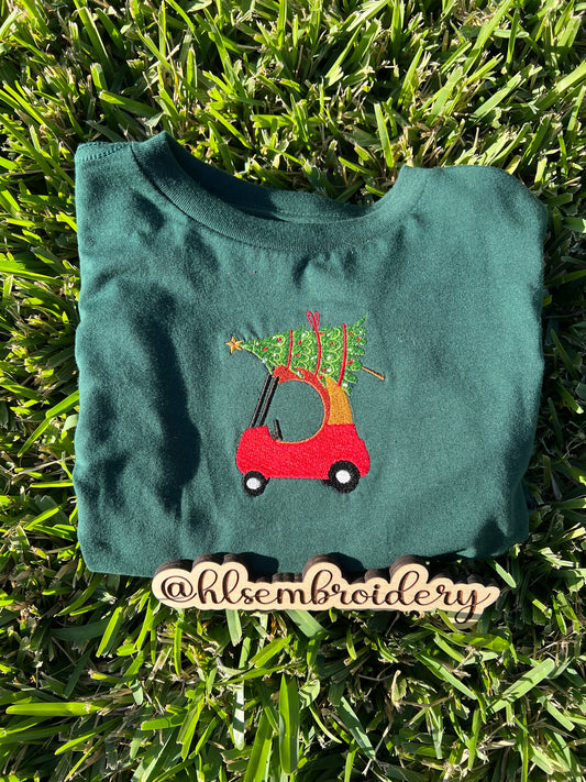 Green shirt with embroidered red car and Christmas tree on top