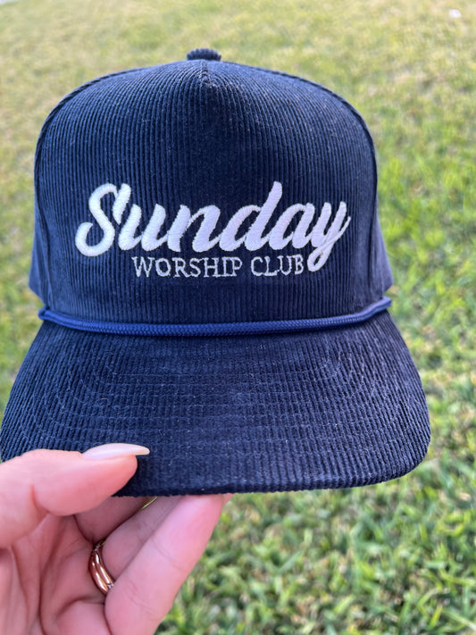 Navy corduroy cap with top, with embroidered text "Sunday worship club"