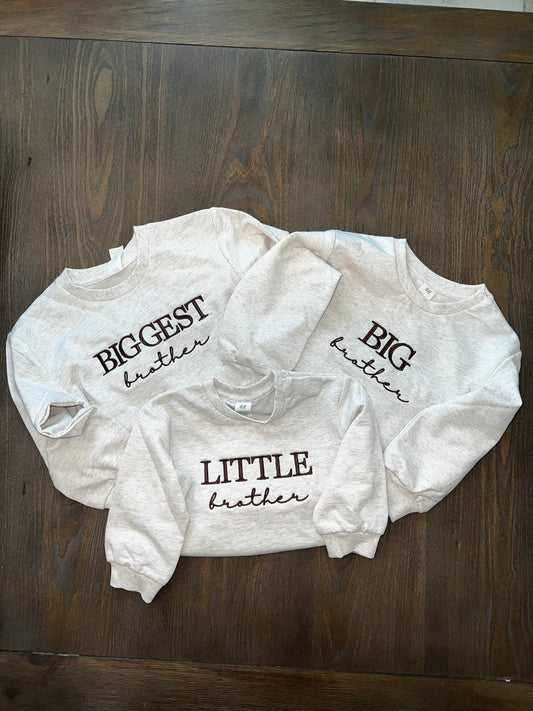 Three shirts with embroidery on the front