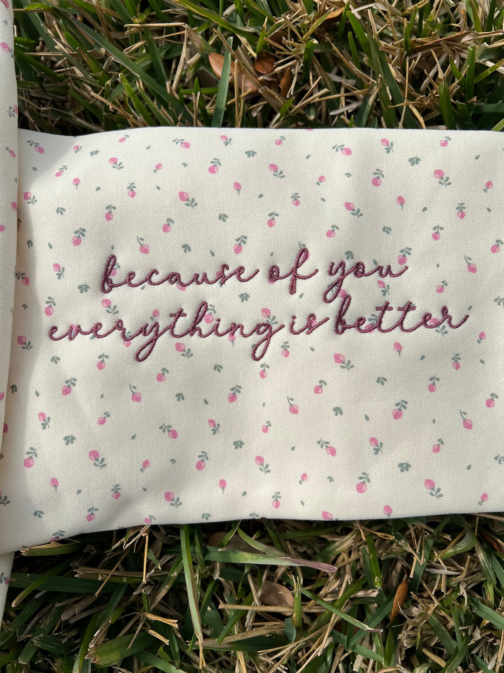 Sleeve embroidery detail that says everything is better because of you 