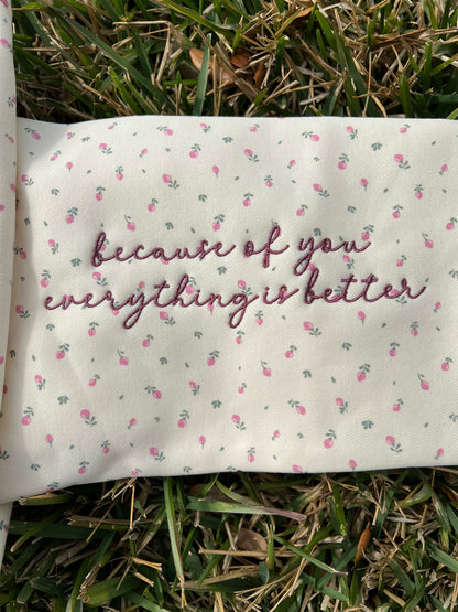 Sleeve embroidery detail that says everything is better because of you 