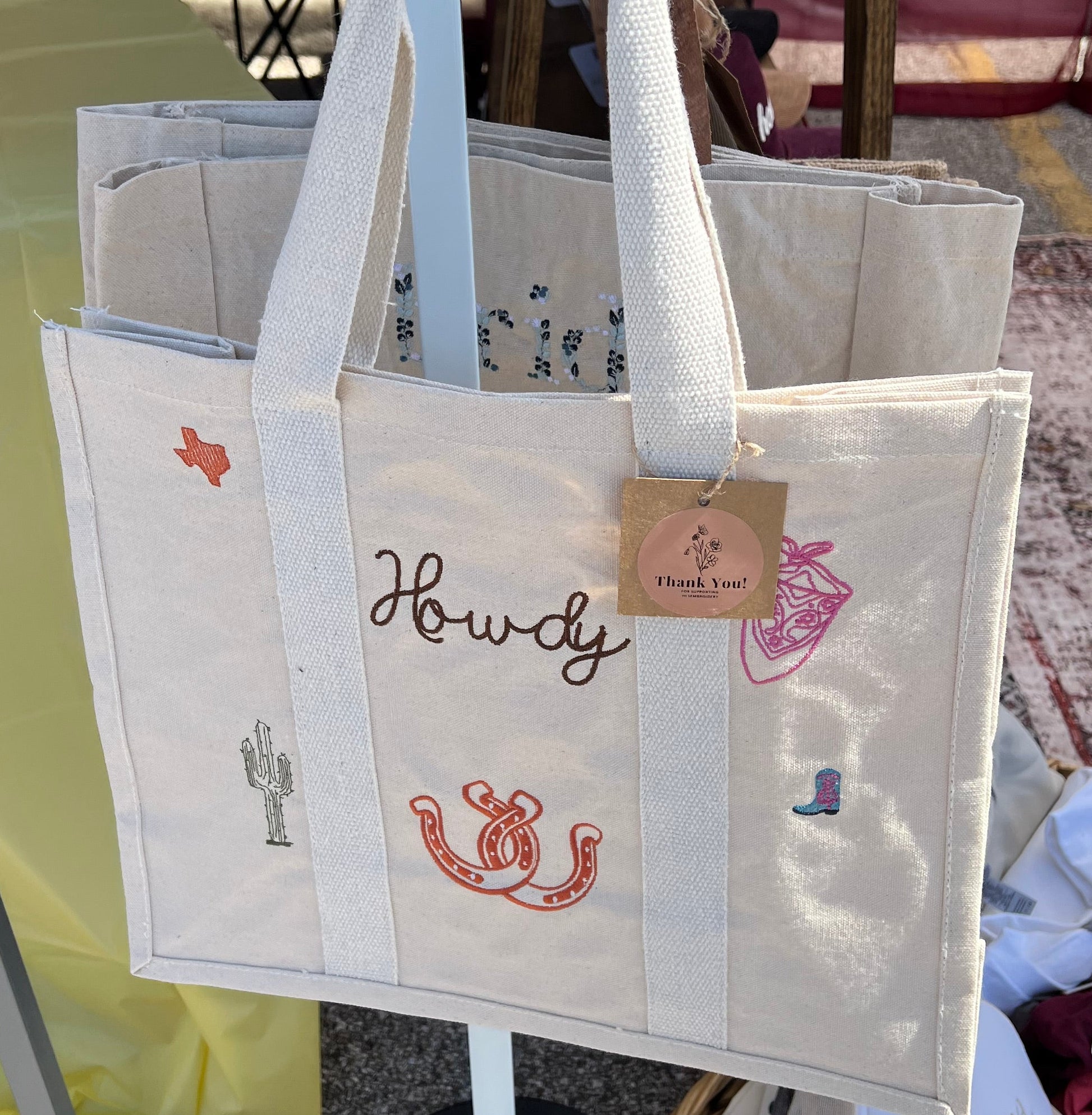Canvas Tote bag with Howdy wording and icons embroidered on the front