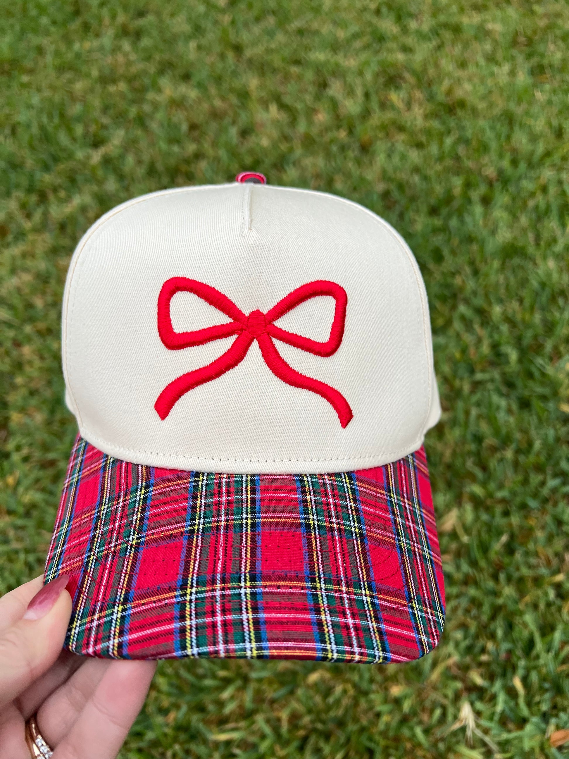 plaid and beige cap with puff bow embroidery. 