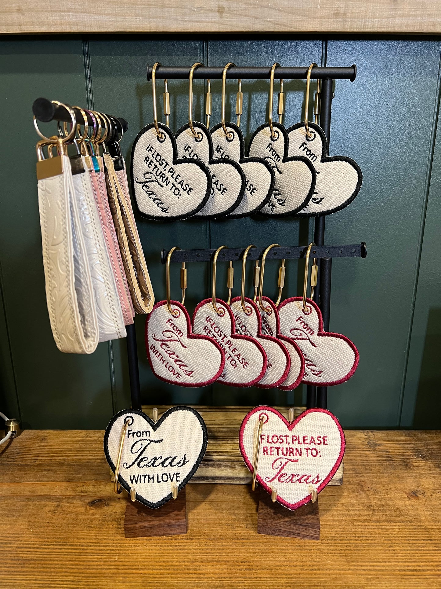 heart shaped keys chains with embroidery writing on it along with keychain loops