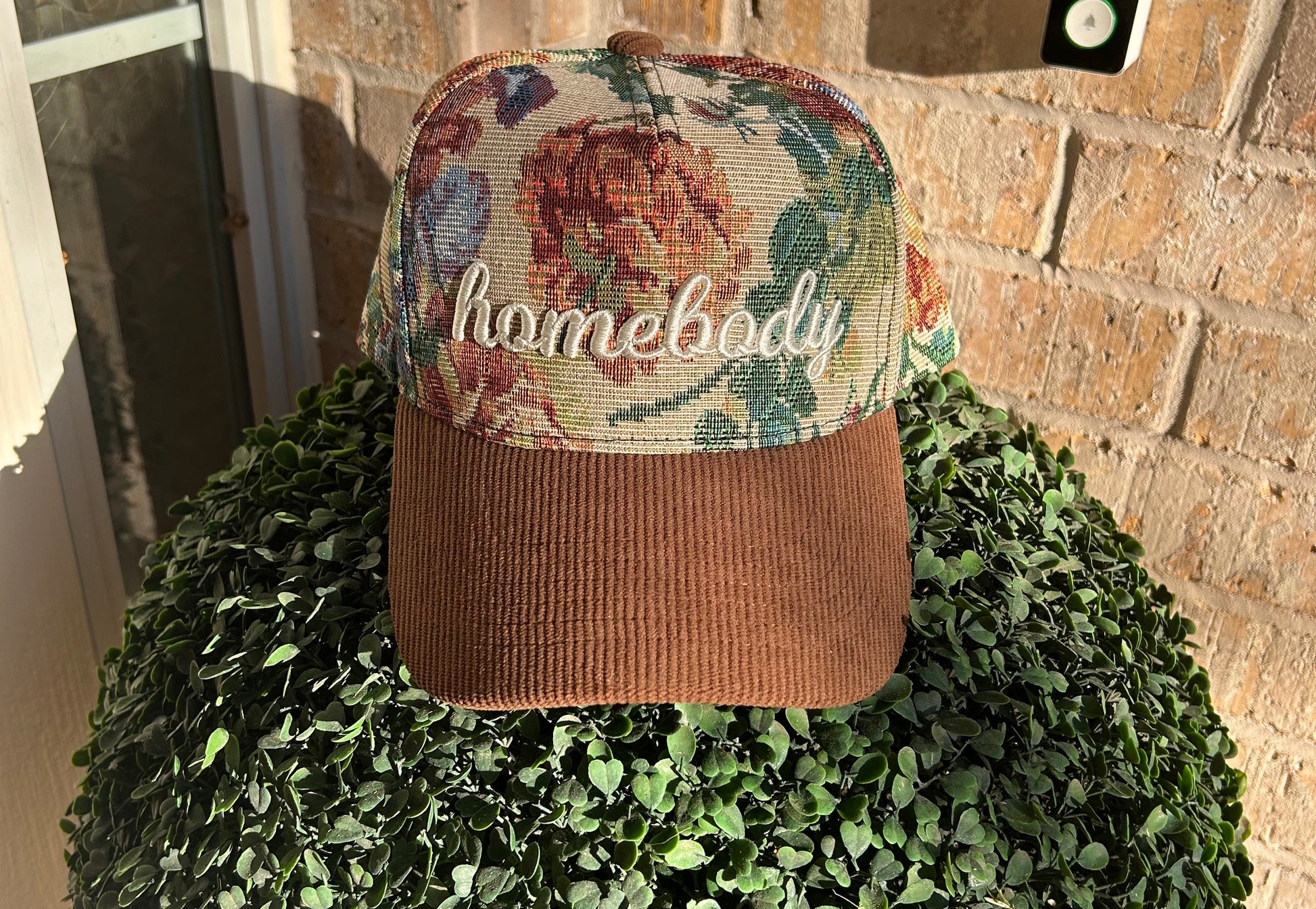 Tapestry hat with word homebody