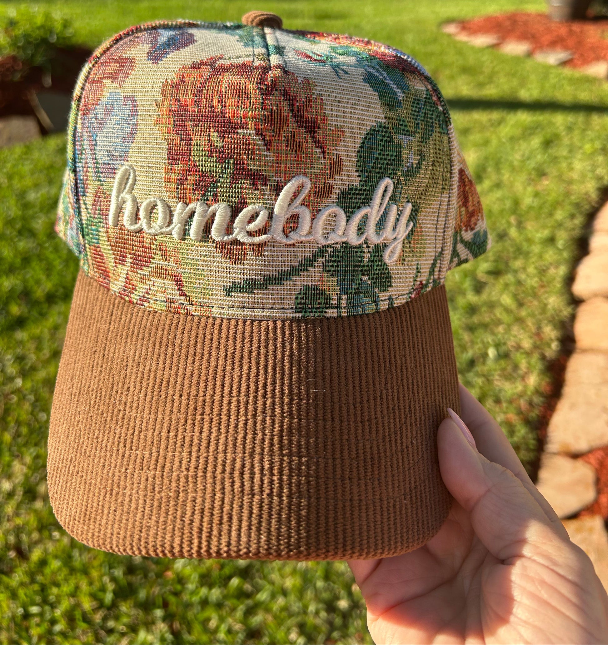 Tapestry hat with word homebody