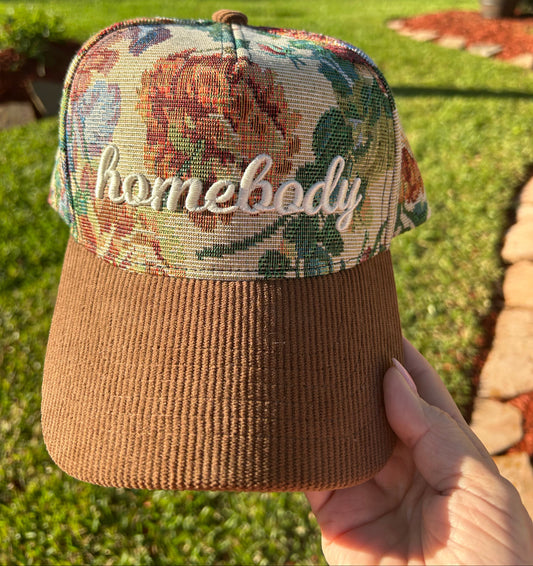 Tapestry hat with word homebody