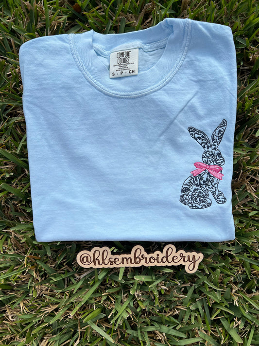 Light blue sweatshirt with a embroidered bunny embroidered on it