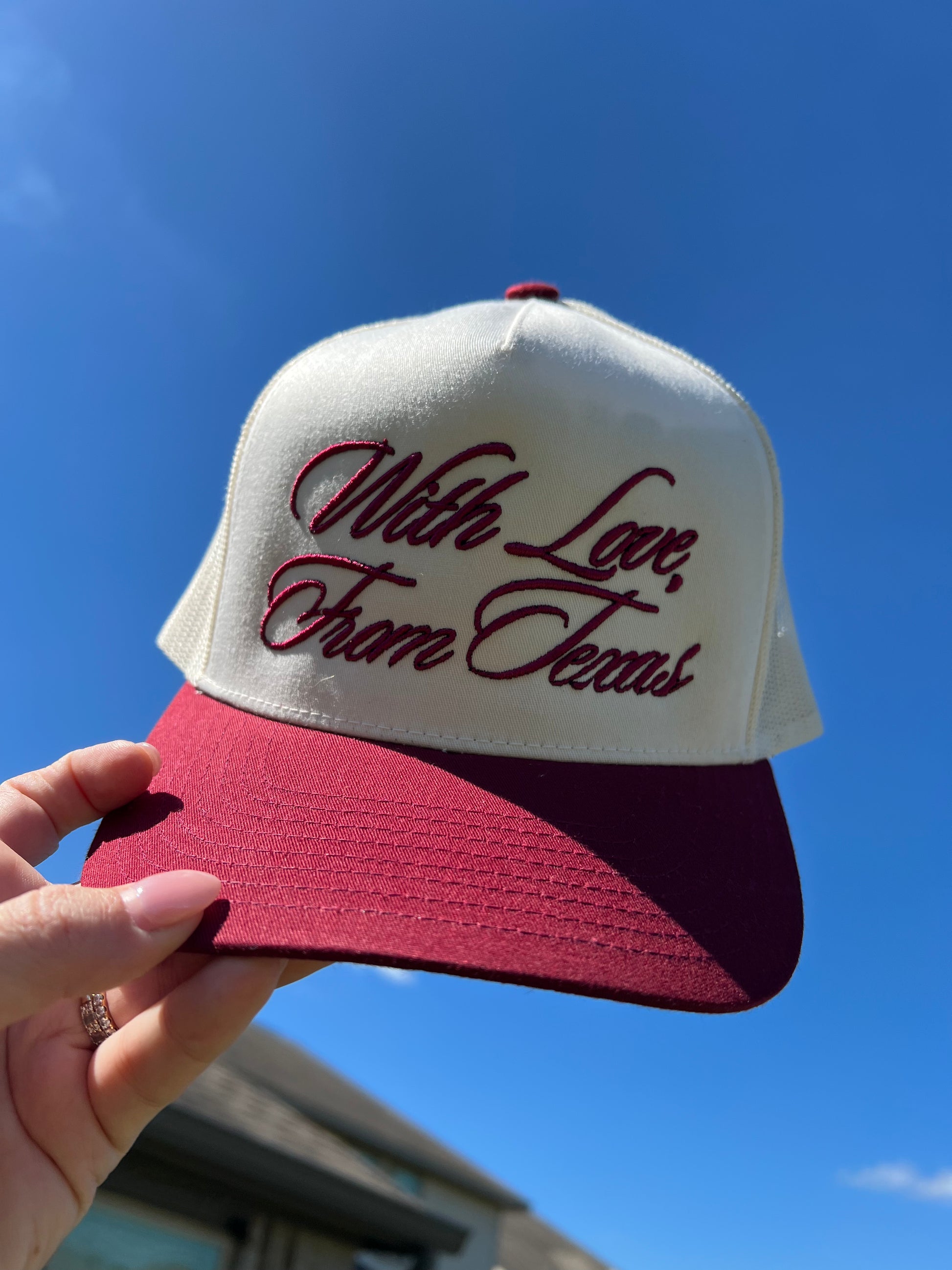 maroon and beige cap with mesh back with puff embroidery "with love, from Texas"