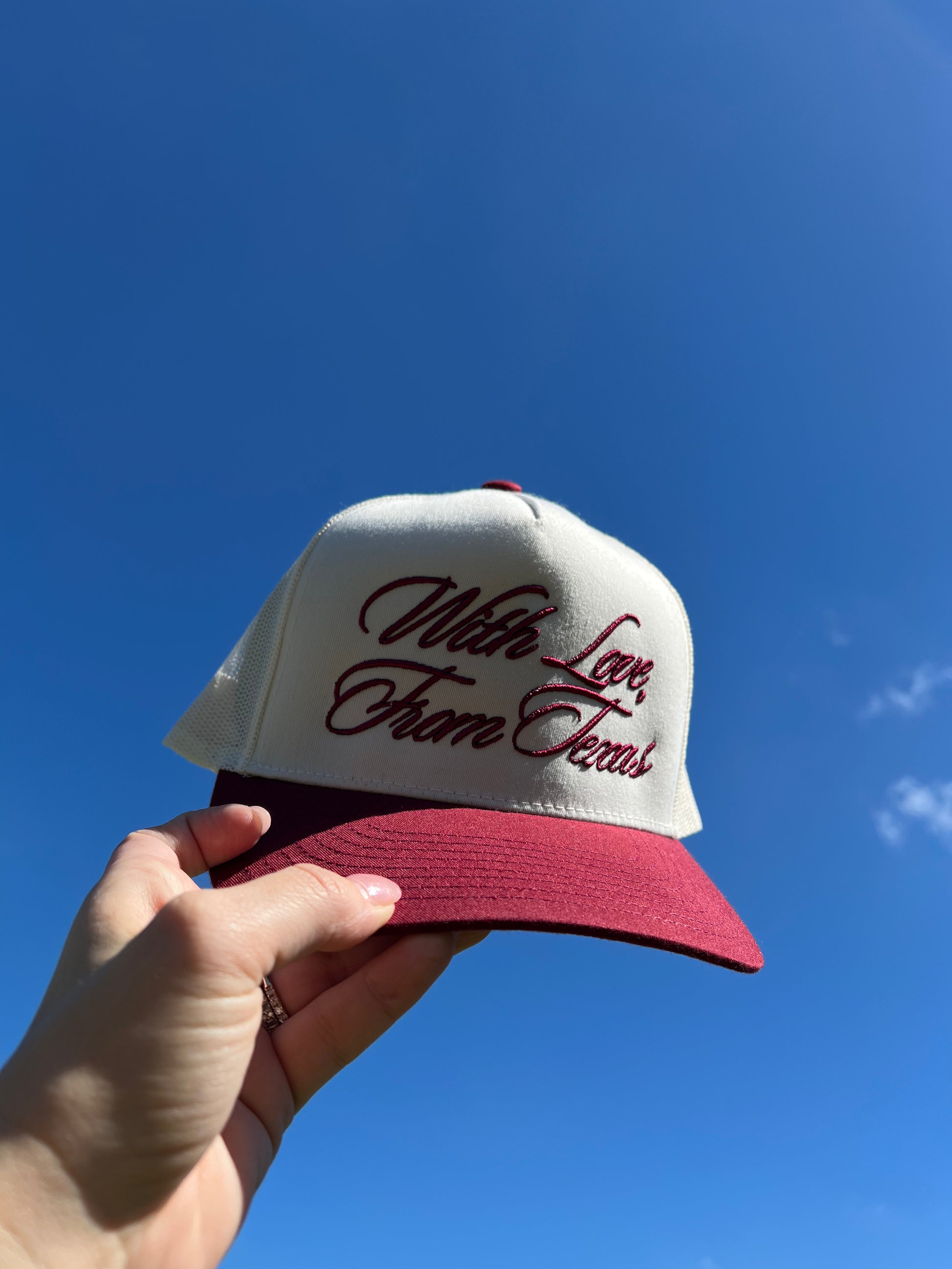 maroon and beige cap with mesh back with puff embroidery "with love, from Texas"