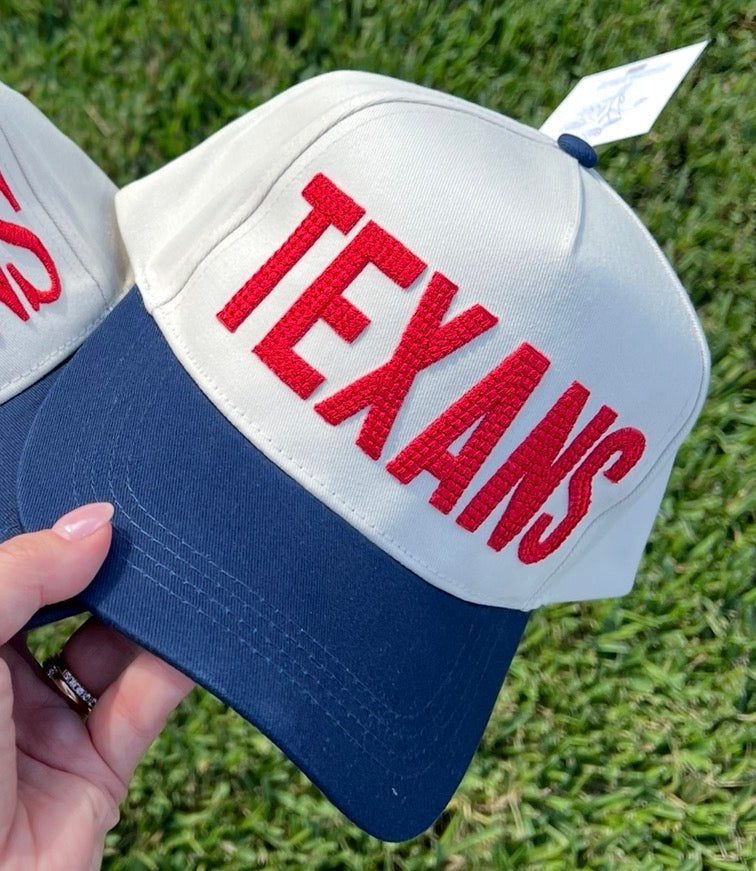 beige and navy cap  with centered crossed puff font.