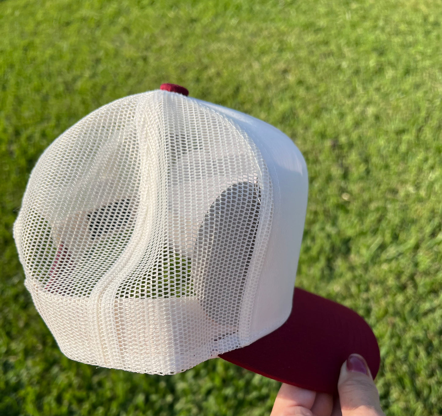 beige and maroon cap with mesh back 