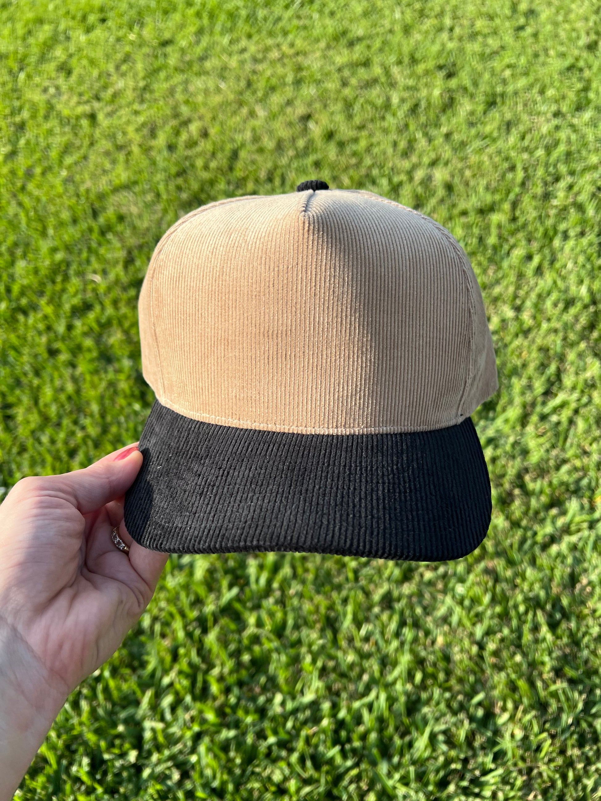 beige and black corduroy cap