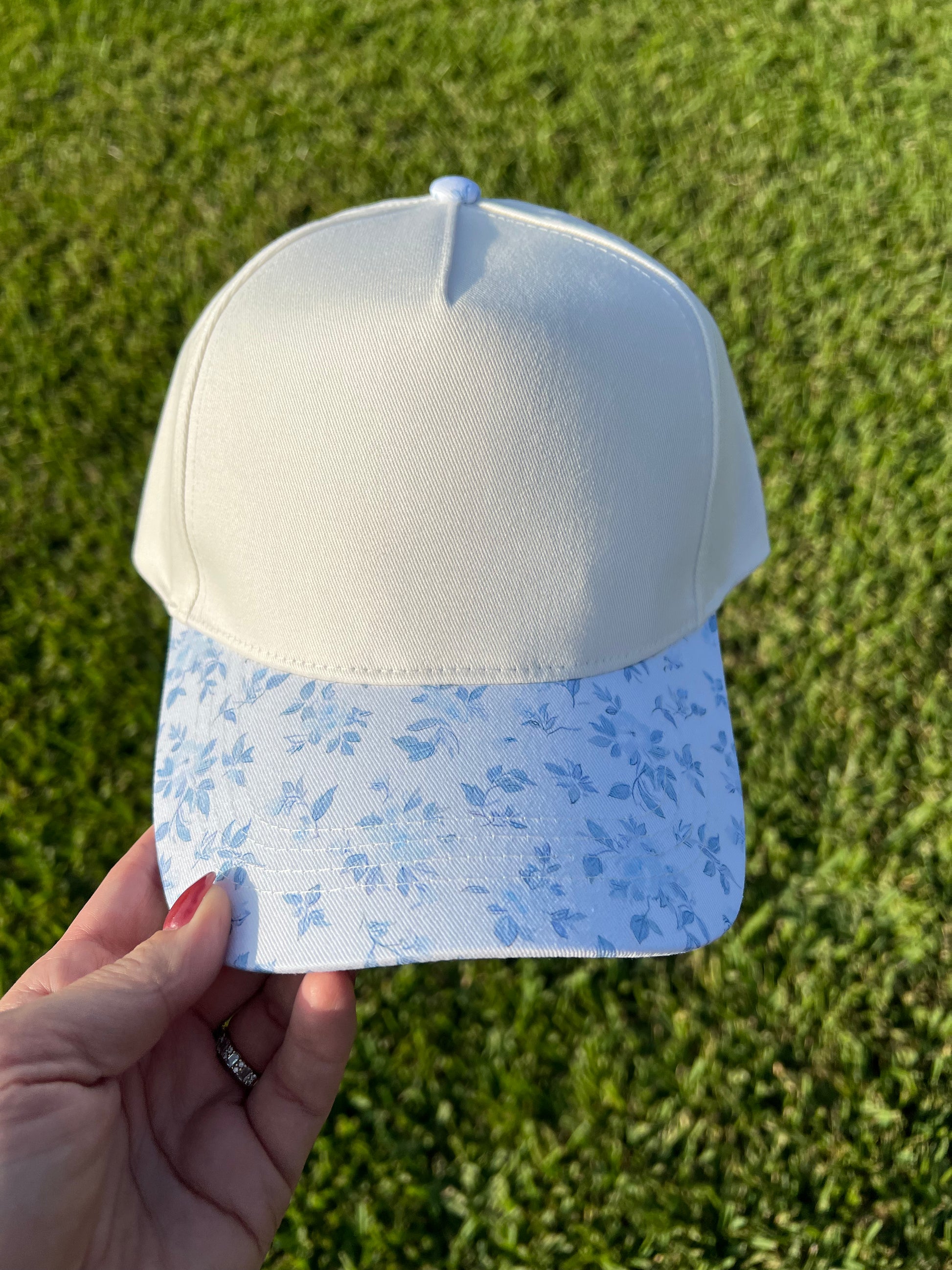 beige and blue floral cap 