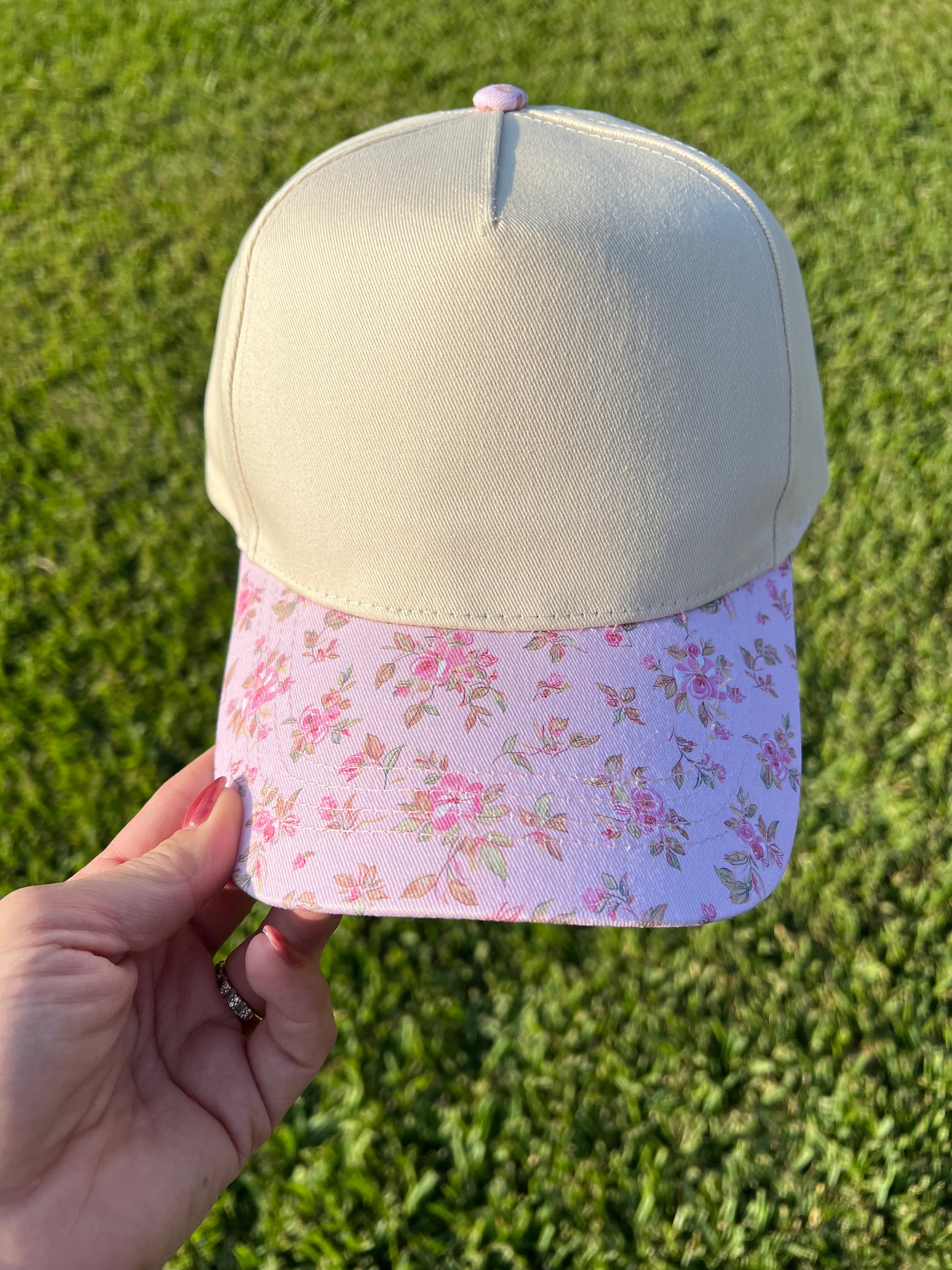beige and pink floral cap 