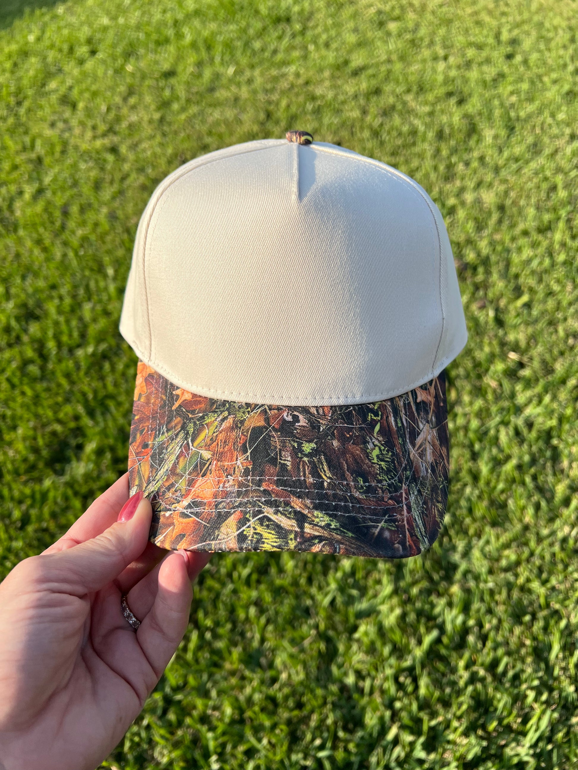 beige and camo cap