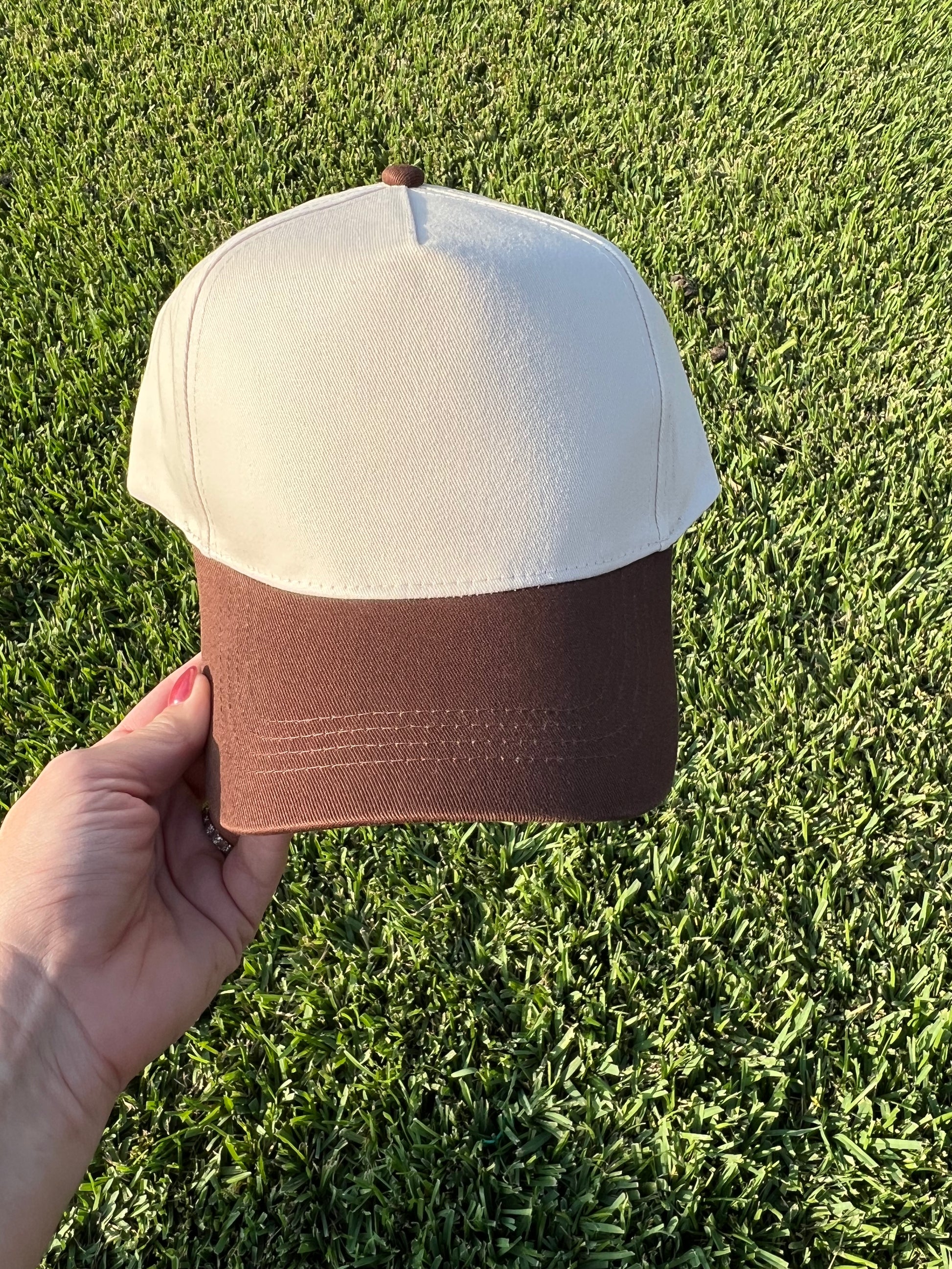 beige and brown cap