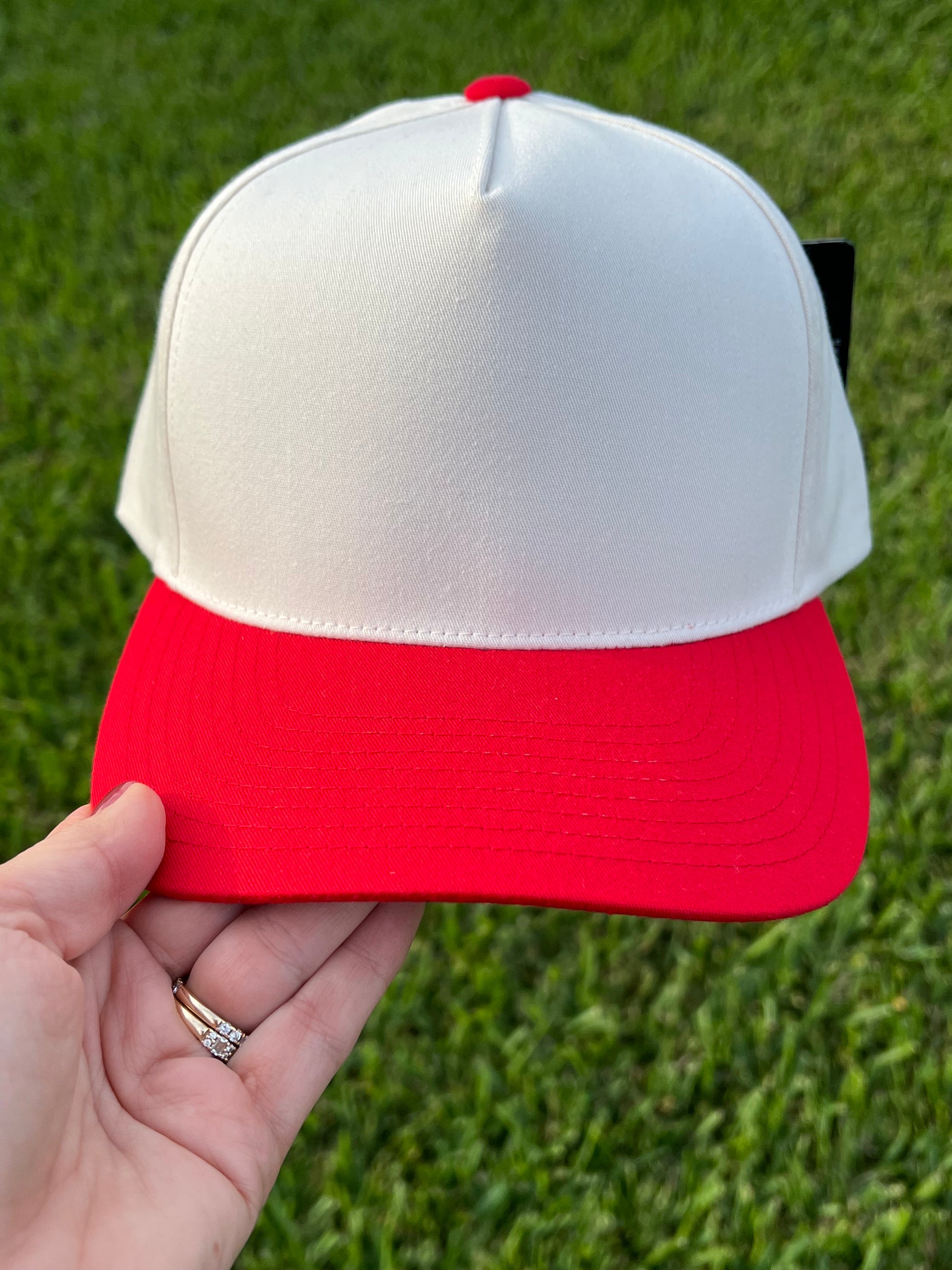 beige and red cap