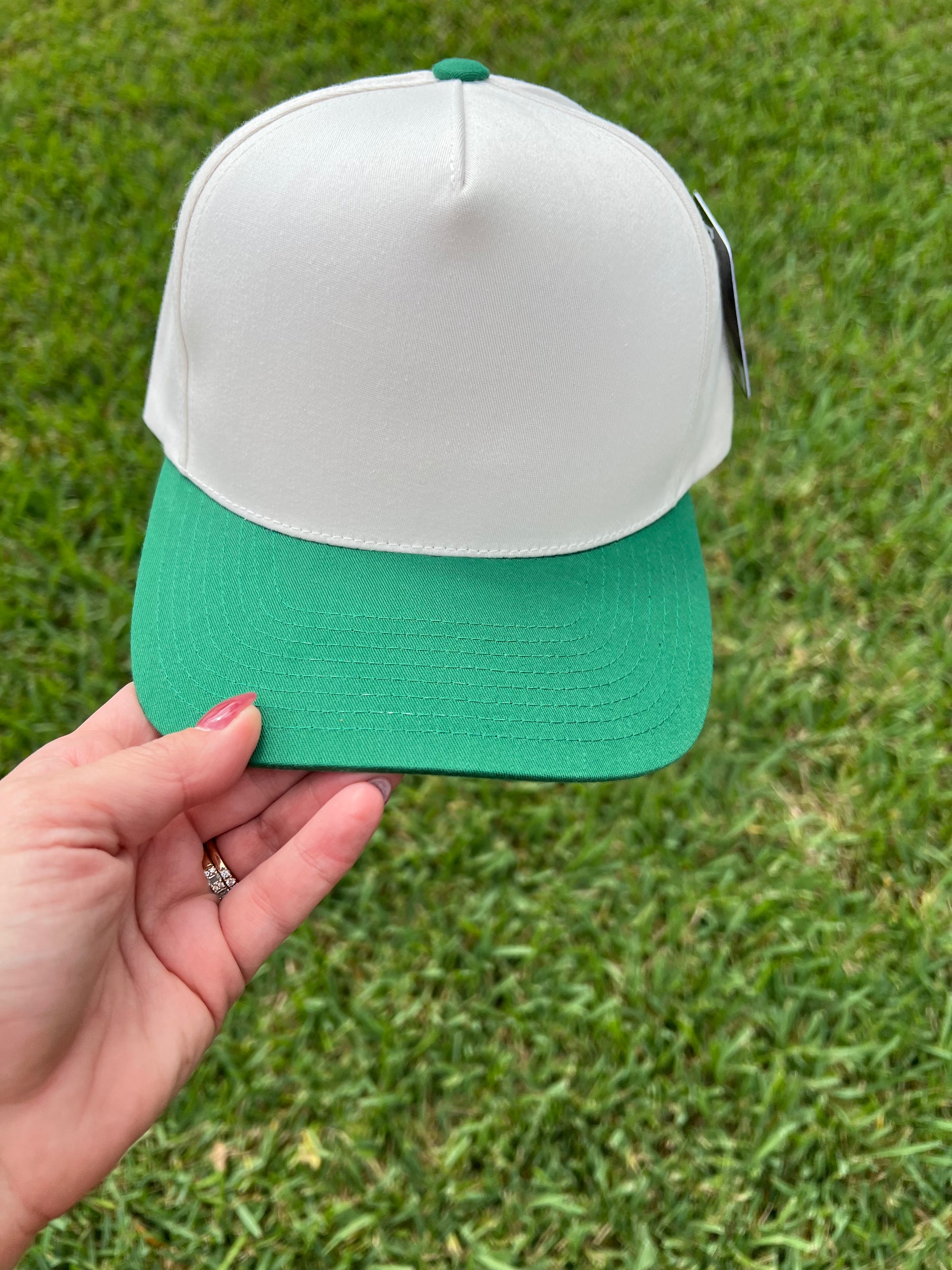 beige and green cap