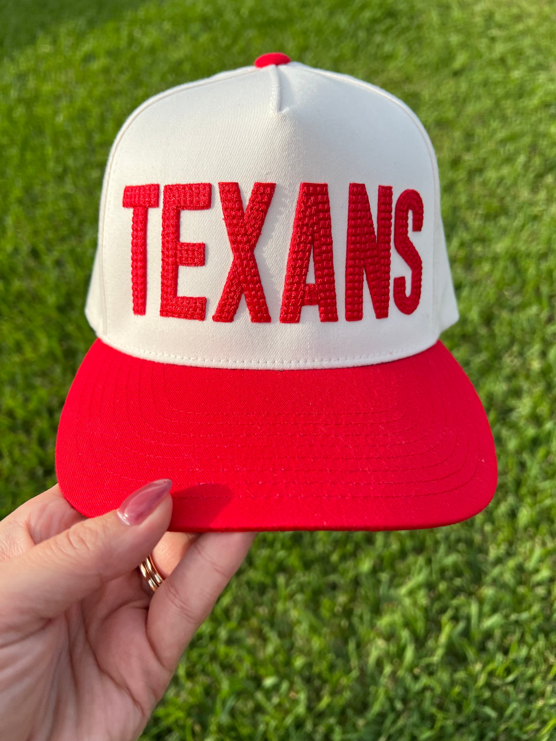 beige and red cap  with centered crossed puff font 