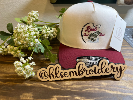 beige and maroon cap with Reel cool Dad with Fish design 