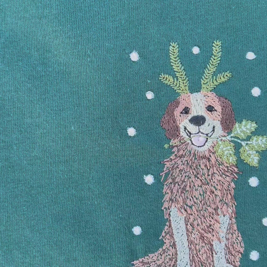 Green Shirt with holiday dog embroidered on the front 