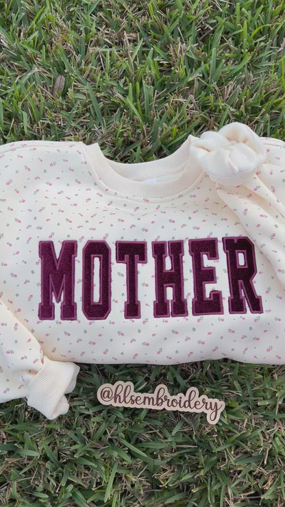 Signature Butter Yellow Floral Crewneck with Mother Embroidery Appliqué and Sparkle Velvet. 