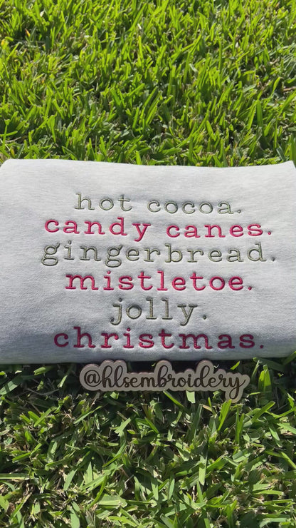 Christmas wording embroidered on gray fabric 