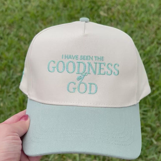 Sage and beige hat with "I have seen the goodness of god"