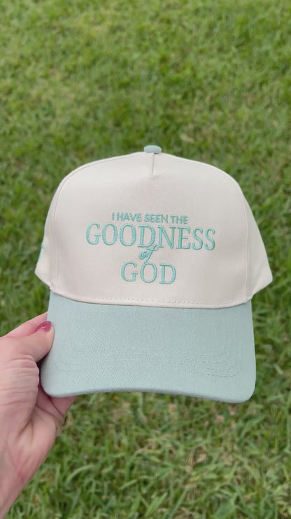 Sage and beige hat with "I have seen the goodness of god"